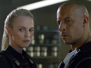 This image released by Universal Pictures shows Charlize Theron, left, and Vin Diesel in "The Fate of the Furious." (Universal Pictures via AP)