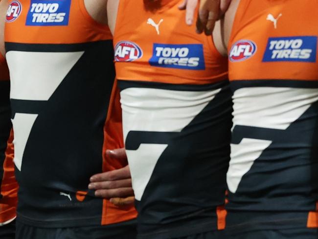 SYDNEY, AUSTRALIA - SEPTEMBER 14:  The Giants line up for the welcome to country and national anthem ceremony during the AFL First Semi Final match between GWS Giants and Brisbane Lions at ENGIE Stadium, on September 14, 2024, in Sydney, Australia. (Photo by Matt King/AFL Photos/via Getty Images)