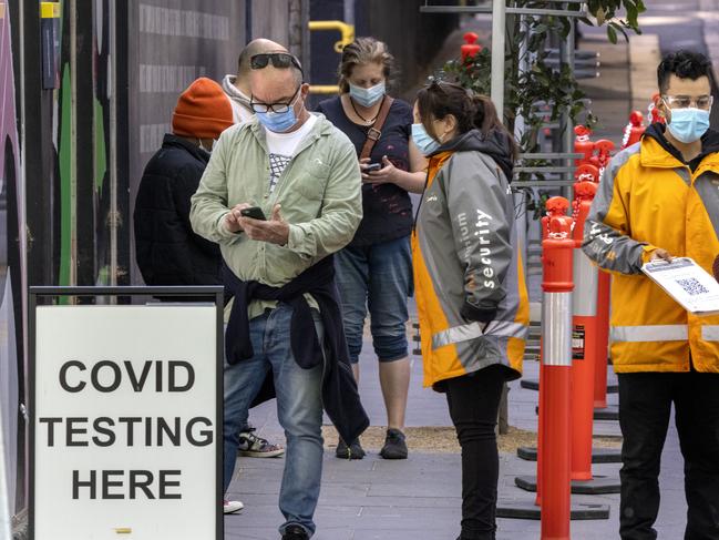 People queue for Covid testing in Bourke Street, Melbourne’s CBD. Picture: NCA NewsWire / David Geraghty