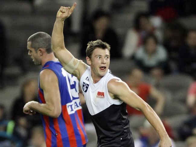 Tom Roach celebrates a goal for North Ballarat in the 2008 VFL grand final.