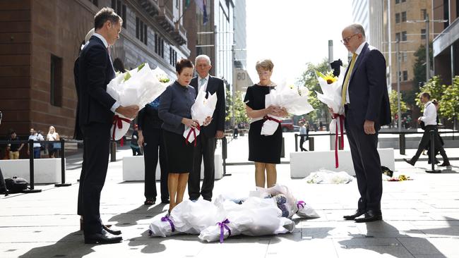 NSW Premier Chris Minns, left, Sydney Lord Mayor Clover Moore, NSW Governor Margaret Beazley and Anthony Albanese lay flowers at Martin Place on Monday. Picture: Richard Dobson