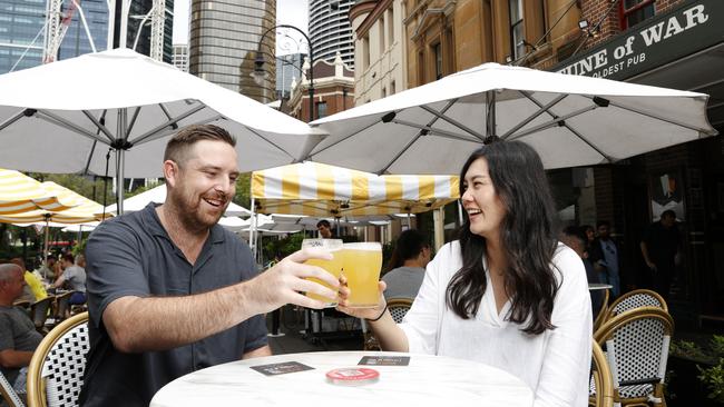 Chris Lucas and Angelena Locke enjoying a drink at the Fortune of War in The Rocks. The NSW government will allow pubs extended trading hours during major events. Picture: Jonathan Ng