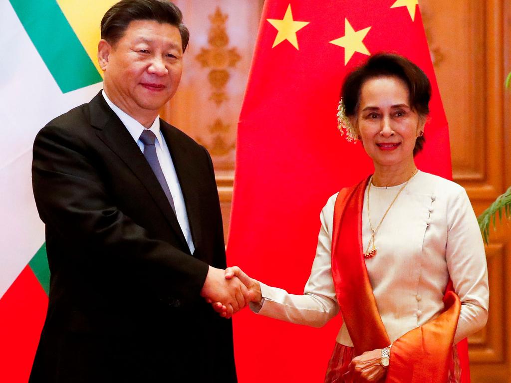 Chinese President Xi Jinping (L) and Myanmar State Counsellor Aung San Suu Kyi shake hands before a bilateral meeting at the Presidential Palace in Naypyidaw. Picture: AFP