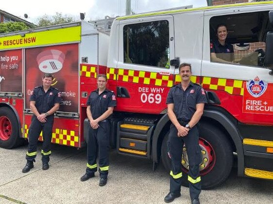 Dee Why Station Officer Jason Collits (left) with fire fighters Donna Holliday, in the truck, Mark Robb and Mitchell Wilson, who helped tackle 25 fires, believed to be deliberately lit, around Dee Why Lagoon in a three-month period. Picture: NSW Fire and Rescue (Dee Why)