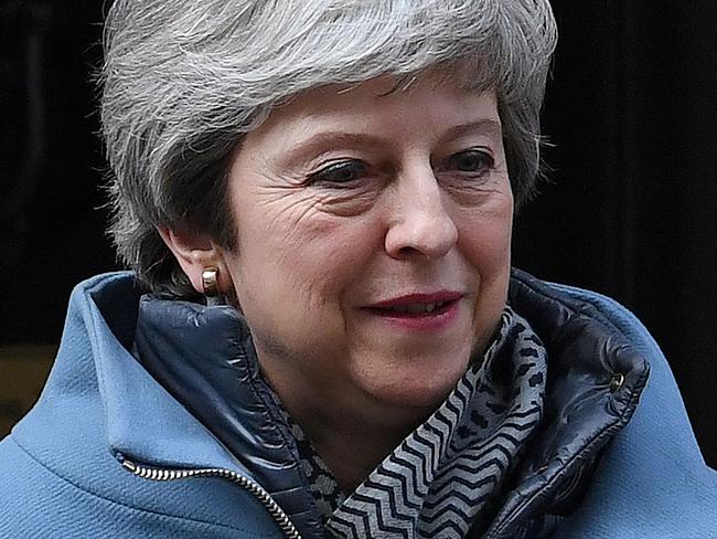 Britain's Prime Minister Theresa May leaves from 10 Downing Street on March 26, 2019. - Britain's parliament began plotting a new Brexit strategy today after seizing the initiative in the floundering process from Prime Minister Theresa May's government in a historic vote. (Photo by Paul ELLIS / AFP)