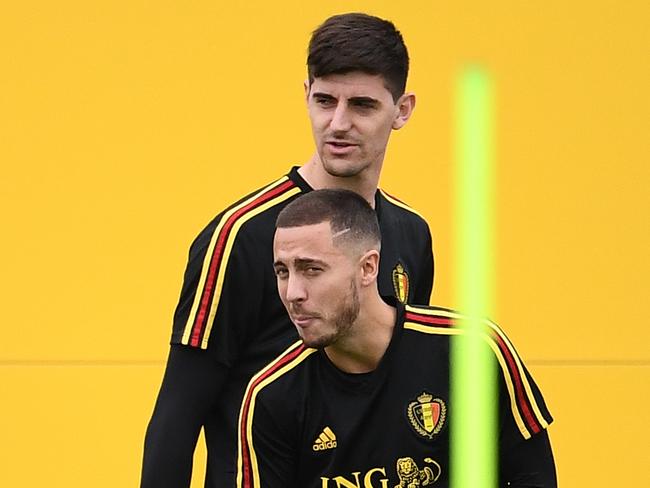 Belgium's goalkeeper Thibaut Courtois (back) and Belgium's forward Eden Hazard attend a training session at the Guchkovo Stadium in Dedovsk, outside Moscow, on July 9, 2018, on the eve of their Russia 2018 World Cup semi-final football match against France.  / AFP PHOTO / FRANCK FIFE