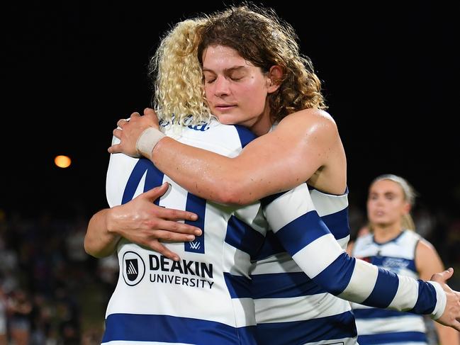 IPSWICH, AUSTRALIA - NOVEMBER 25: Georgie Prespakis and Meghan McDonald of the Cats hug after their defeat during the AFLW First Preliminary Final match between Brisbane Lions and Geelong Cats at Brighton Homes Arena, on November 25, 2023, in Ipswich, Australia. (Photo by Albert Perez/Getty Images)