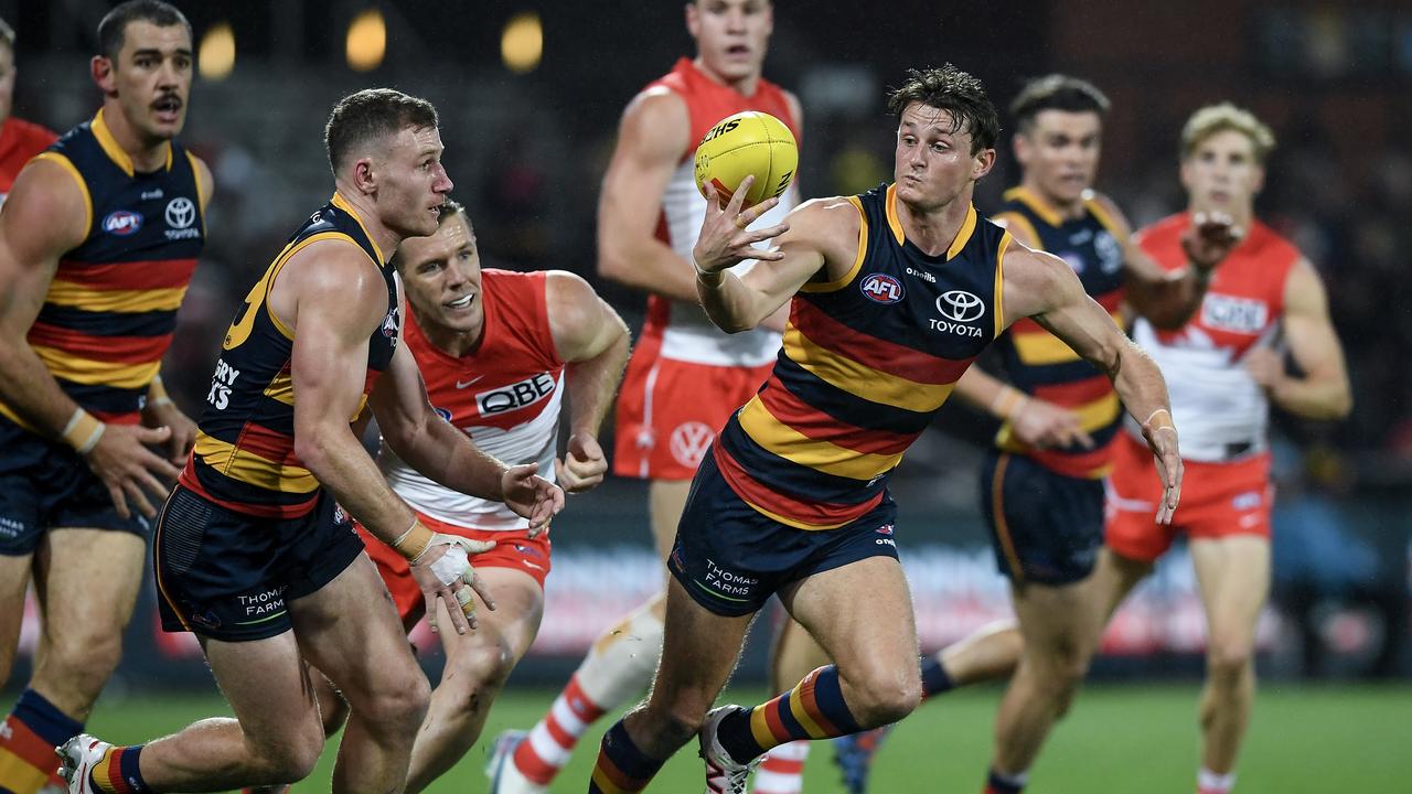 ADELAIDE, AUSTRALIA - AUGUST 19: Matt Crouch of the Crows controls the ball during the round 23 AFL match between Adelaide Crows and Sydney Swans at Adelaide Oval, on August 19, 2023, in Adelaide, Australia. (Photo by Mark Brake/Getty Images)