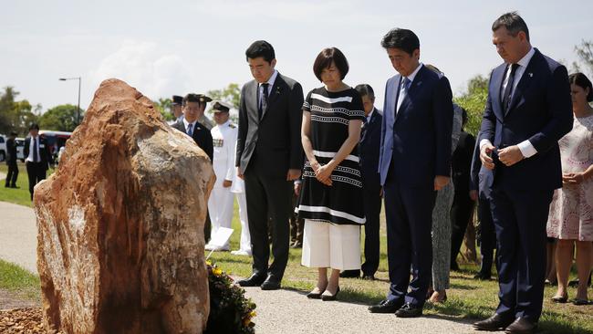 Japan's Prime Minister Shinzo Abe stands next to his wife Akie and Chief Minister Michael Gunner during a ceremony at a memorial of the 80-crew Japanese submarine I-124, which was sunk off Darwin in January 1942, in Darwin, Australia. Picture: AAP