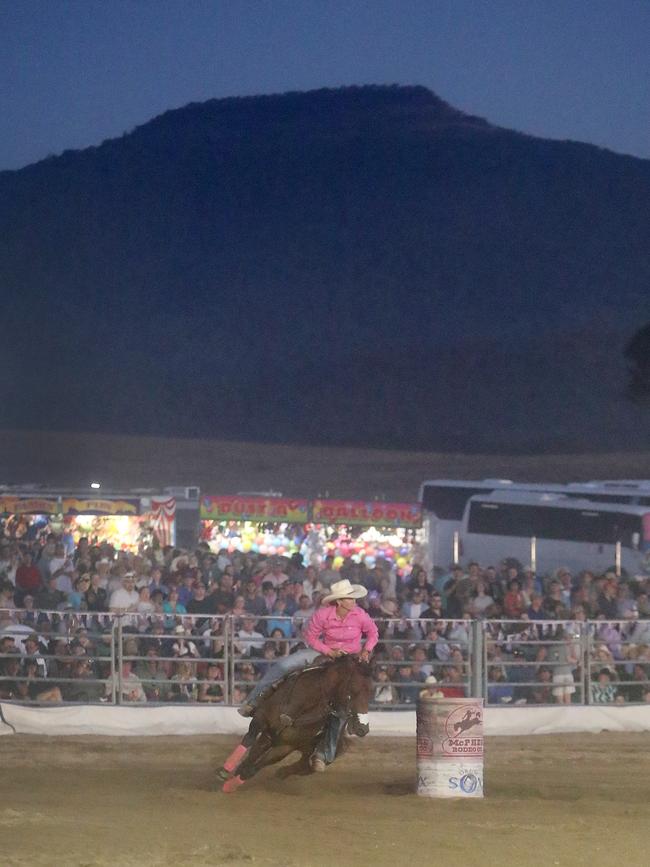 Barrel Racing as the sun sets on the Merrijig Rodeo. Picture: Yuri Kouzmin