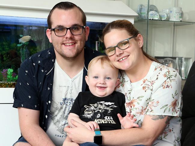 Karen Christiansen, 26, with baby Zavier Hamilton and partner Zak Hamilton. Karen has donated 240 litres of her breast milk to the Queensland Milk Bank. It's the biggest donation to the bank to date. Picture: Richard Gosling, AAP