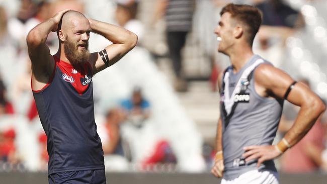 Max Gawn battled hard against Scott Lycett (right) and Paddy Ryder on Saturday. Picture: Daniel Pockett (AAP).