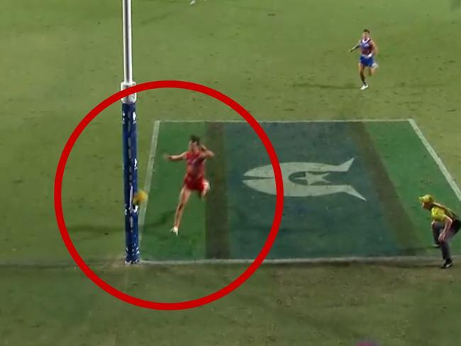 Umpires review a goal decision during the Suns-Bulldogs fixture at TIO Stadium.