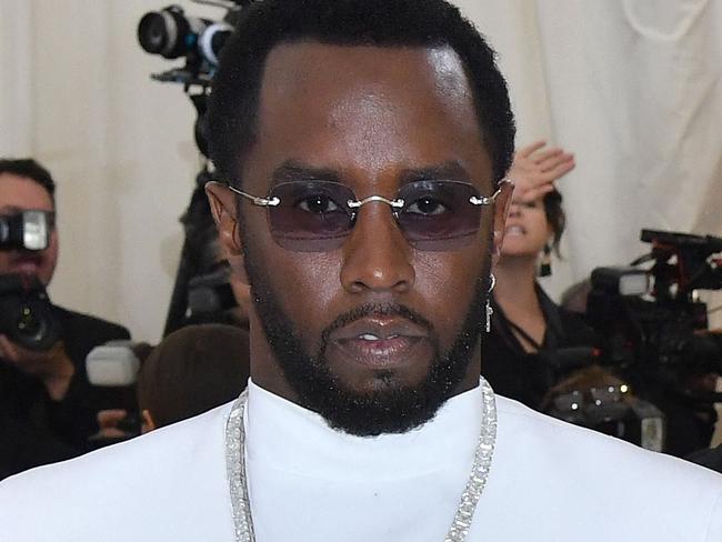 (FILES) Sean Combs (L) and singer Cassie Ventura arrives for the 2018 Met Gala on May 7, 2018, at the Metropolitan Museum of Art in New York. Superstar rapper and music industry mogul Sean Combs was sued November 16 by the singer Cassie, who accused him of rape and physical abuse. The hip-hop artist, known as both Puff Daddy or Diddy, subjected the R&B singer, whose real name is Casandra Ventura, to more than a decade of coercion by physical force and drugs as well as a 2018 rape, she said in her suit, filed in federal court in Manhattan. (Photo by ANGELA WEISS / AFP)