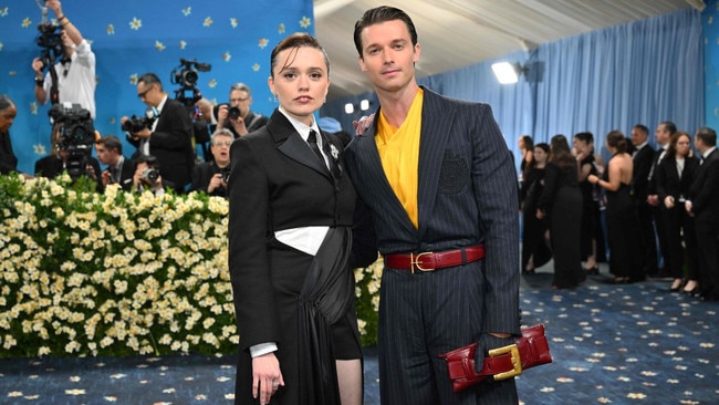 Patrick Schwarzenegger attending alongside his White Lotus co-star Aimee Lou Wood, wearing a Balmain suit with a bold yellow shirt. Aimee wore a deconstructed suit-gown by Priya Ahluwalia. Picture: Getty