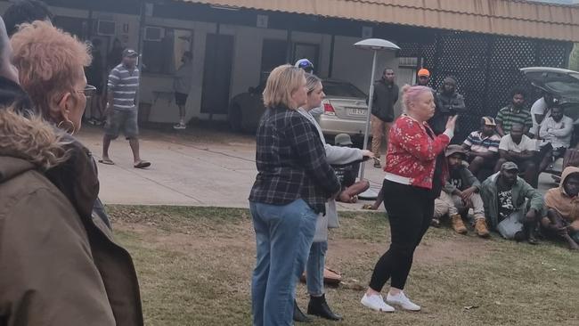 A Department of Education, Skills and Employment Office of the Pacific officer confronts frustrated South Sea Islander workers about their issues with the scheme at a Bundaberg motel on June 26, 2022.