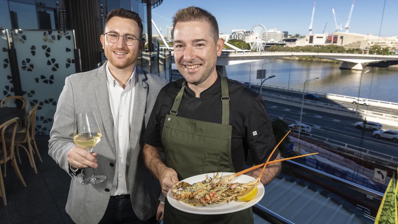 The Lex restaurant manager Cedric Rinaldo and chef de cuisine Pawel Klodowski with their signature North Queensland Champagne lobster dish at W Brisbane Hotel. Picture: Matthew Poon