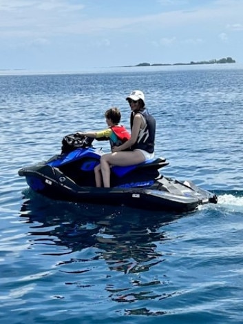 Marly heads out on a jetski with a young copilot. Picture: Instagram