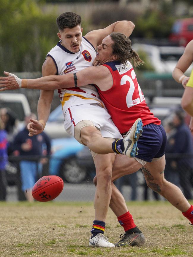 SFL: Chelsea Heights’ Aaron Rhodes tries to stop Ryan Farmer of Caulfield Bears. Picture: Valeriu Campan