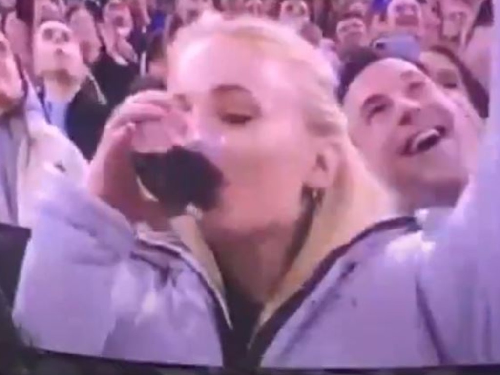 Reports suggest Turner (pictured skolling wine at a hockey game) "enjoys partying", while Jonas prefers to stay at home with their children.