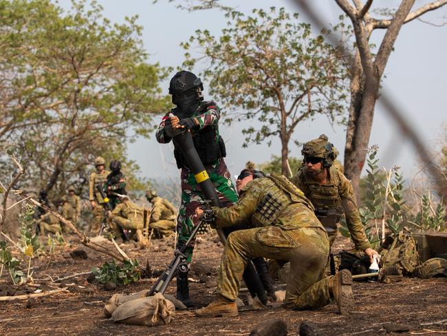 Australian Army soldiers from the 1st Battalion, the Royal Australian Regiment and a Indonesian National Armed Forces soldier fire an 81mm mortar as part of the Combined Joint Live Fire Exercise during Exercise Keris Woomera 2024 in East Java, Indonesia. PHOTO: CPL Janet Pan