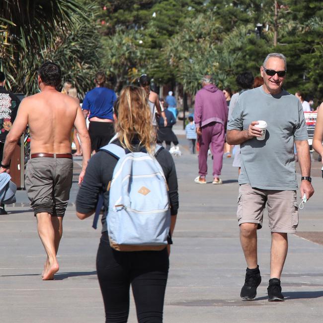 Surfers Paradise wakes up to its first day in lockdown due to the latest Covid-19 scare. Crowds walking around Surfers Paradise without masks. Picture Glenn Hampson