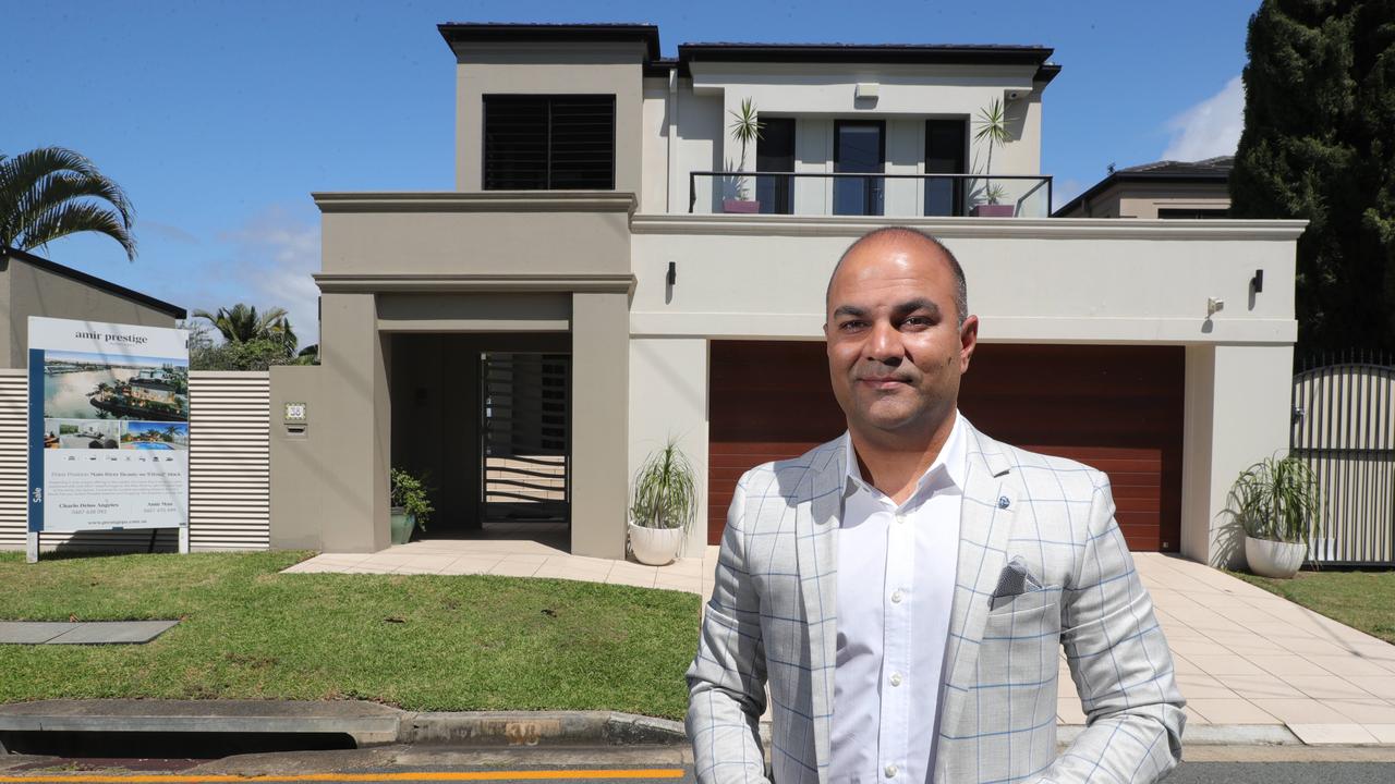 Realtor Amir Mian outside a home he sold at Paradise Island. Picture: Glenn Hampson.