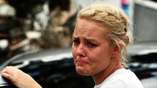 Haldane Street resident, Jodie Green watching tragedy of Haldane Street in Graceville unfold. It was one of the worst hit streets in Graceville.