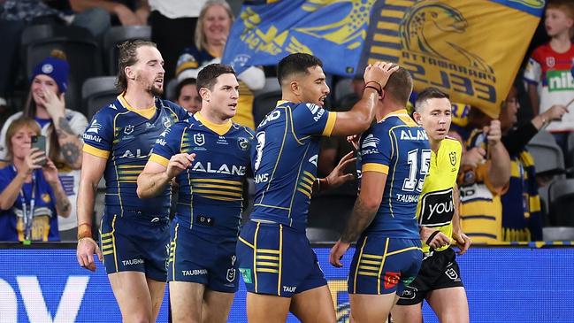 Clint Gutherson celebrates with his Eels teammates after scoring a try. Picture: Getty Images