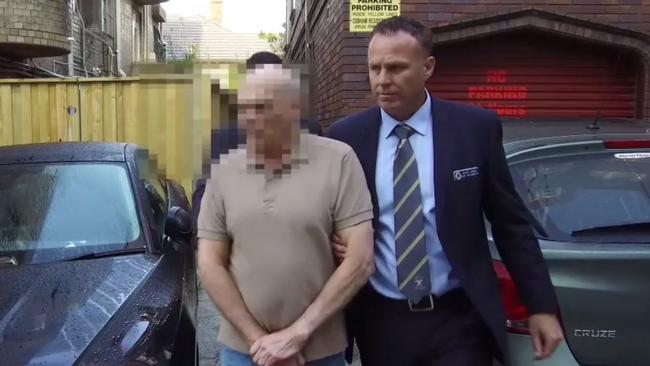 The man was taken to Waverley Police Station and charged with eight counts of robbery. Picture: NSW Police