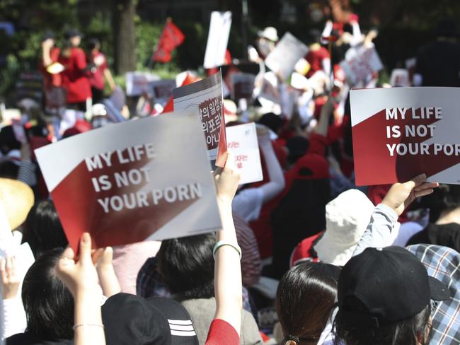 Woman protesters stage a rally to demand stronger government action to fight the spread of intimate photos and footage taken by hidden cameras, which they say have women living in constant anxiety and distress, in Seoul, South Korea, Saturday, July 7, 2018. (Ryu Hyo-lim/Yonhap via AP)