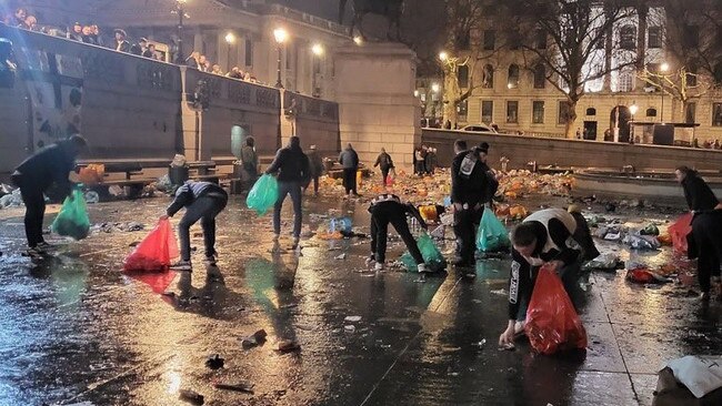 Newcastle fans clean up Trafalgar Square ahead of the 2023 Carabao Cup Final at Wembley Stadium.