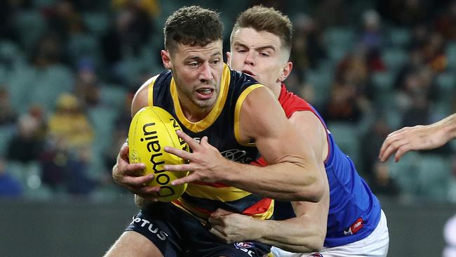 Brown takes on Melbourne's Bayley Fritsch. He enjoyed a strong 189-game AFL career with Adelaide. Picture: Sarah Reed