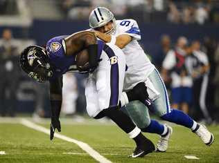 Dallas Cowboys quarterback Tony Romo (R) tries to tackle Baltimore Ravens player Courtney Upshaw (L) after a fumble in the first half of their pre-season game at AT&T; Stadium in Arlington, Texas, USA, 16 August 2014. . Picture: EPA/LARRY W. SMITH