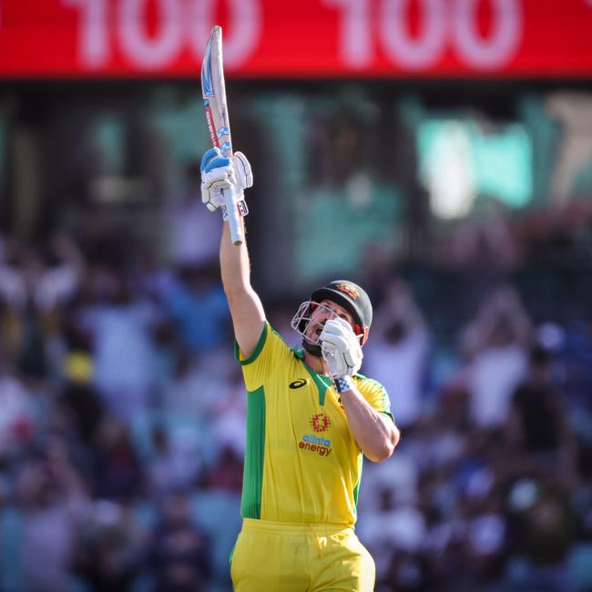 Australia's captain Aaron Finch pays tribute to Phillip Hughes upon reaching his century. Picture: David Gray/AFP