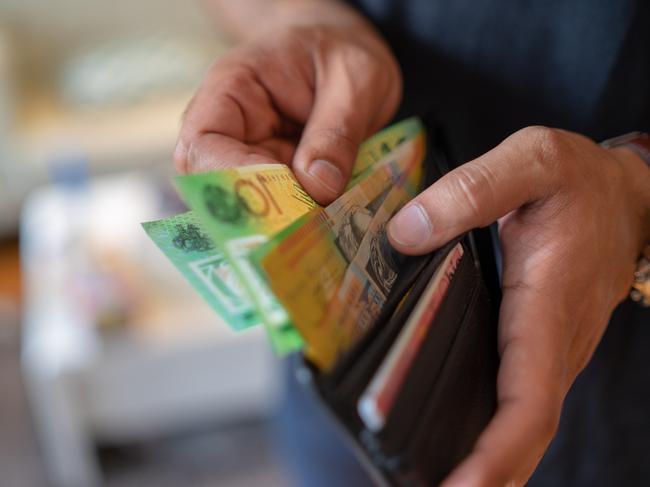 a male taking money out of the valet.  Picture: istock