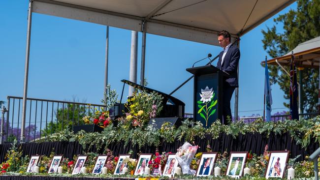 Chris Minns speaks in front of pictures of the 10 victims. Picture: NSW Premier Office via NCA NewsWire.