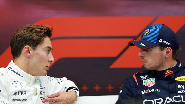 Pole position qualifier Max Verstappen of the Netherlands and Oracle Red Bull Racing and Second placed qualifier George Russell exchange words. (Photo by Bryn Lennon/Getty Images)