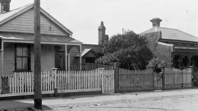 A street scene from Clifton Hill after a major street brawl. Pickets were wrenched off the fence and used as weapons. Credit: Victoria Police Museum