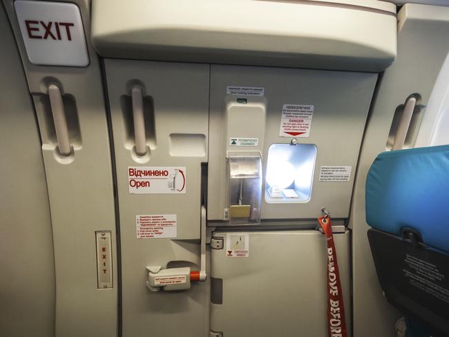 Closeup shot of emergency exit door in airplane