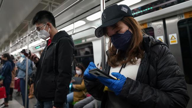 Chinese commuters ride the subway in Beijing overnight (AEDT). Picture: Getty Images