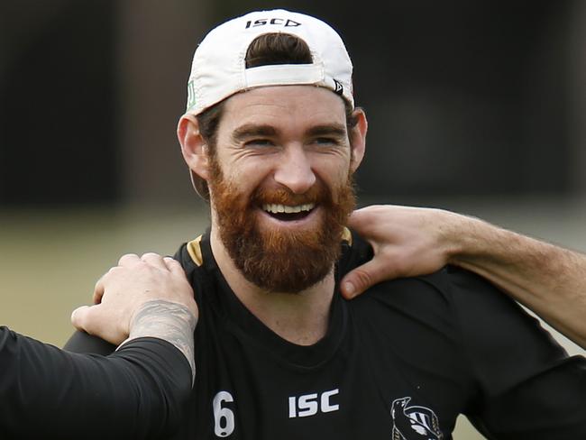 MELBOURNE, AUSTRALIA - JULY 24: Jeremy Howe, Tyson Goldsack and Levi Greenwood warm up before  a Collingwood AFL training session at Holden Centre on July 24, 2019 in Melbourne, Australia. (Photo by Darrian Traynor/Getty Images)