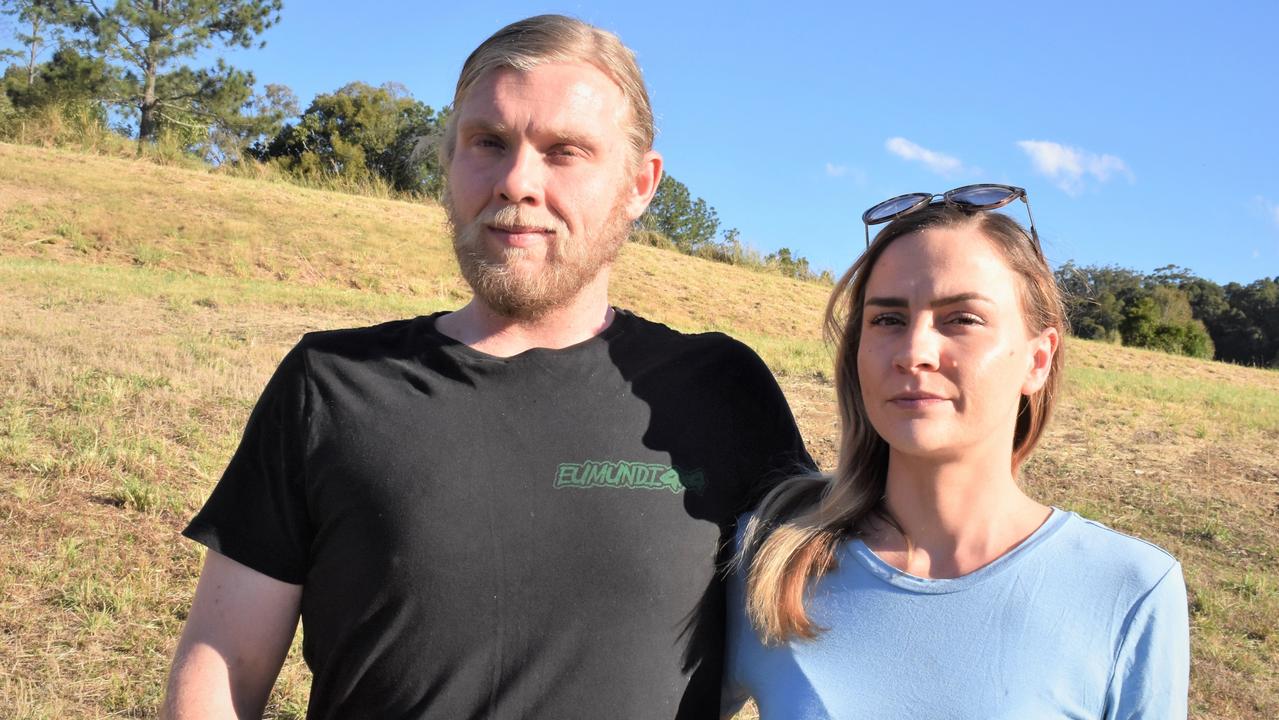 Elle Evans pictured with partner Jackson Mason is suing developer Burrell Developments after the company invoked the sunset clause to terminate her Eumundi land contract.