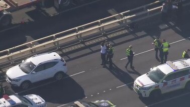 A man could be seen being led away by emergency services.