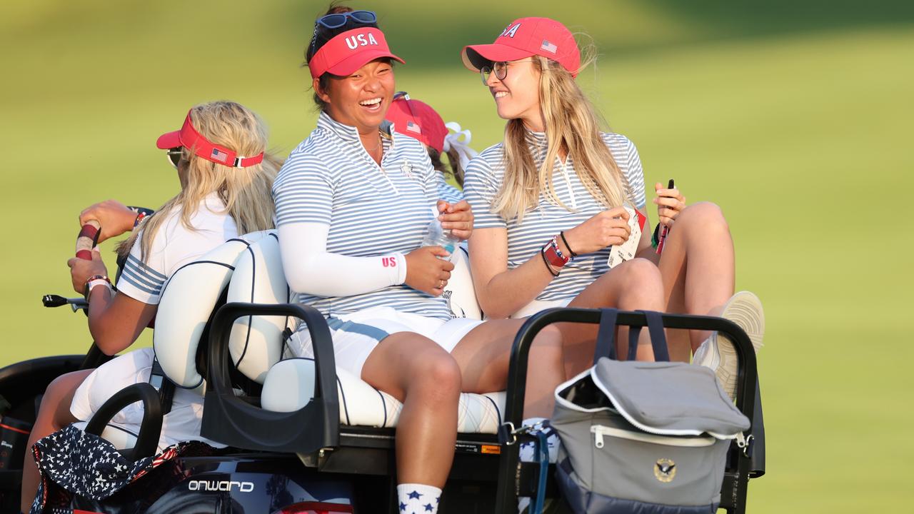 GAINESVILLE, VIRGINIA - SEPTEMBER 14: Megan Khang and Nelly Korda of Team United States are driven from the course during the Saturday Foursomes matches against Team Europe during the second round of the Solheim Cup 2024 at Robert Trent Jones Golf Club on September 14, 2024 in Gainesville, Virginia. (Photo by Gregory Shamus/Getty Images)