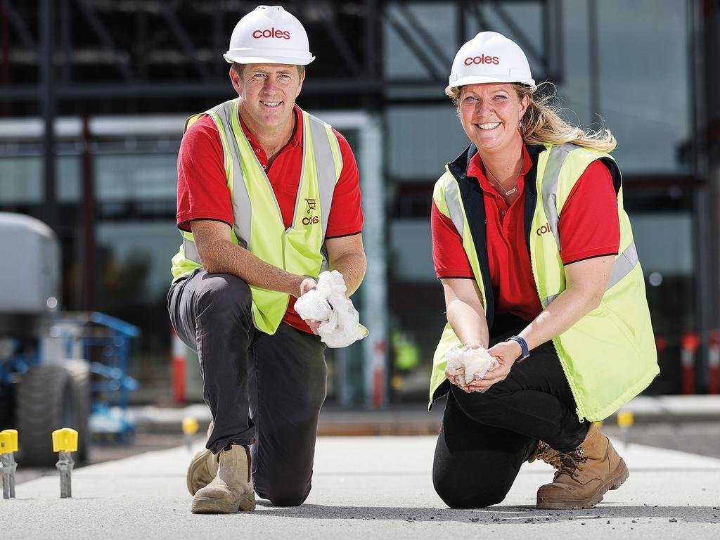 Victorian construction manager Fiona Lloyd pictured with colleague Luke at the Coles Cobblebank site, where six million pieces of recycled soft plastic went into the carpark, footpaths and curbing after being turned into a revolutionary concrete aggregate called Polyrok. Picture: supplied