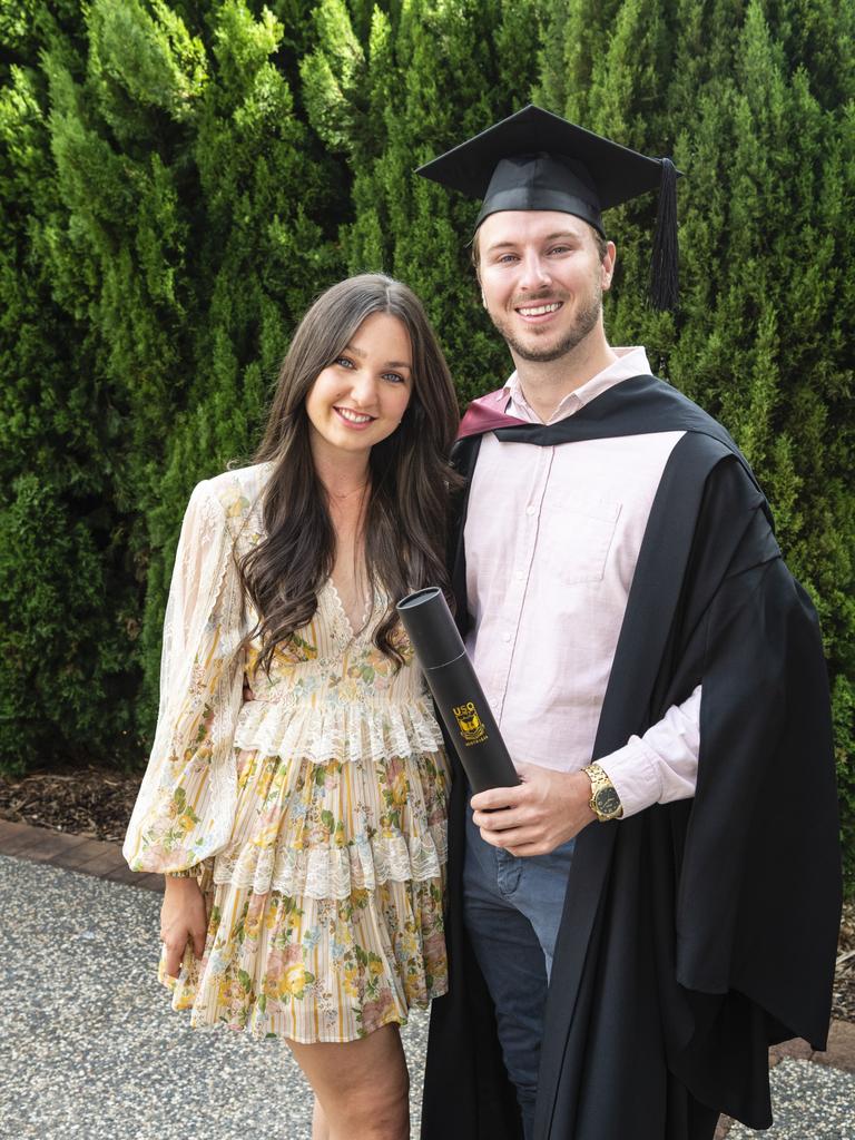 Bachelor of Spatial Science Technology graduate Jamie Quinn celebrates his degree with Ruby Carnes at the UniSQ graduation ceremony at Empire Theatres, Tuesday, December 13, 2022. Picture: Kevin Farmer