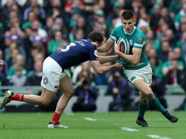 Ireland’s Sam Prendergast is held by France’s Pierre-Louis Barassi. Picture: Getty Images