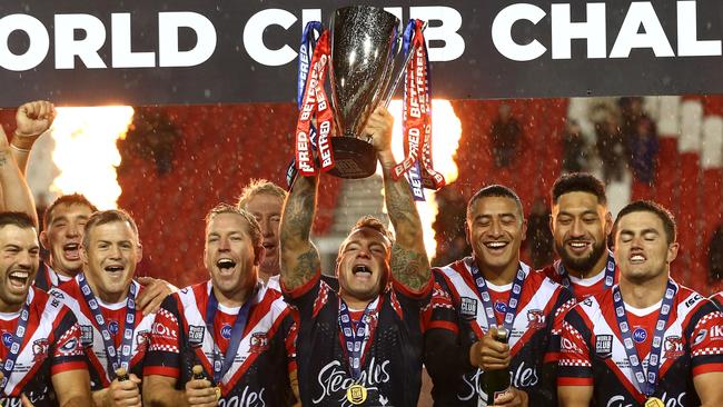 Jake Friend and the Sydney Roosters celebrate after beating St Helens. Picture: Lewis Storey/Getty Images