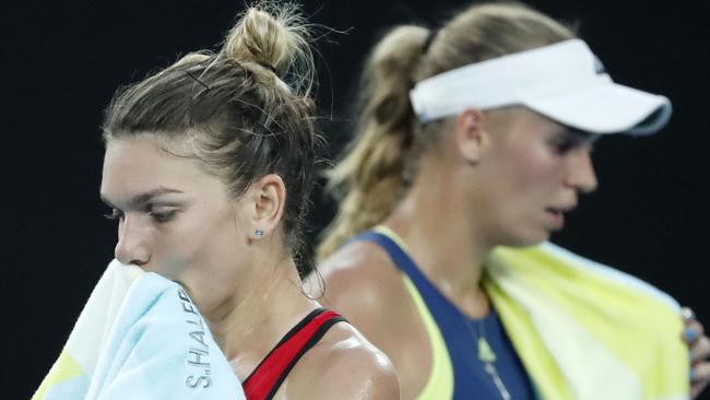 Caroline Wozniacki and Simona Halep both battled the elements on Saturday night. Picture: AAP Images